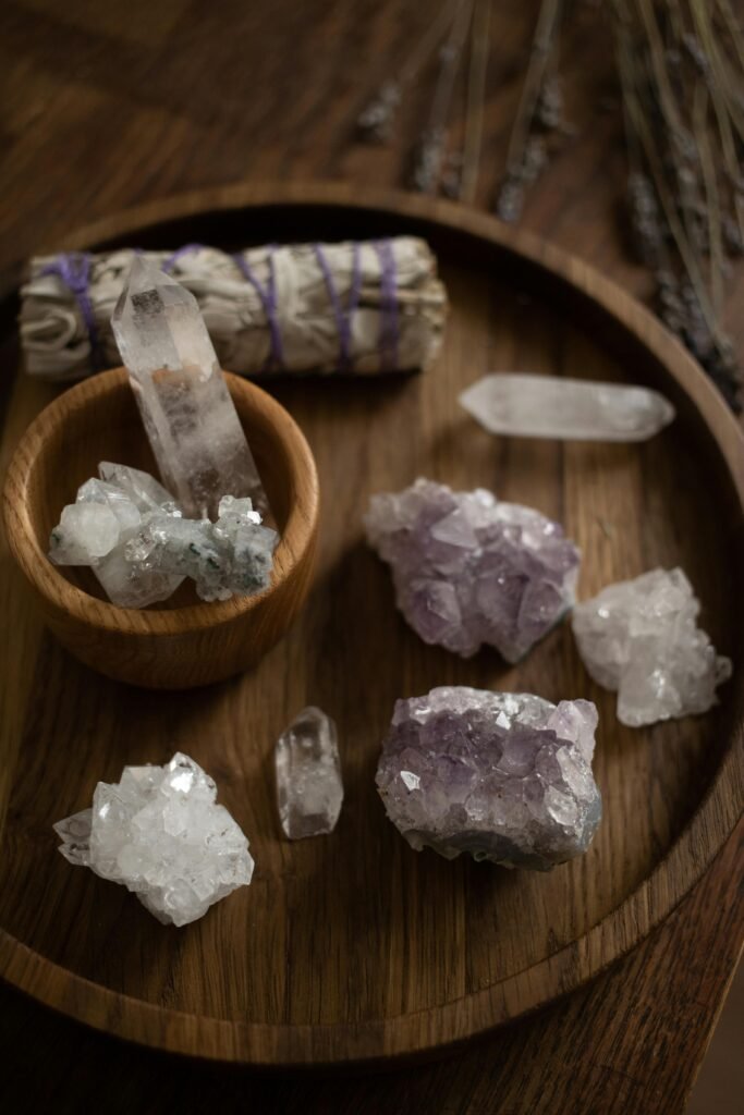 pexels-photo-6766259-6766259 A collection of healing crystals on a wooden tray for alternative therapy and crystal healing.